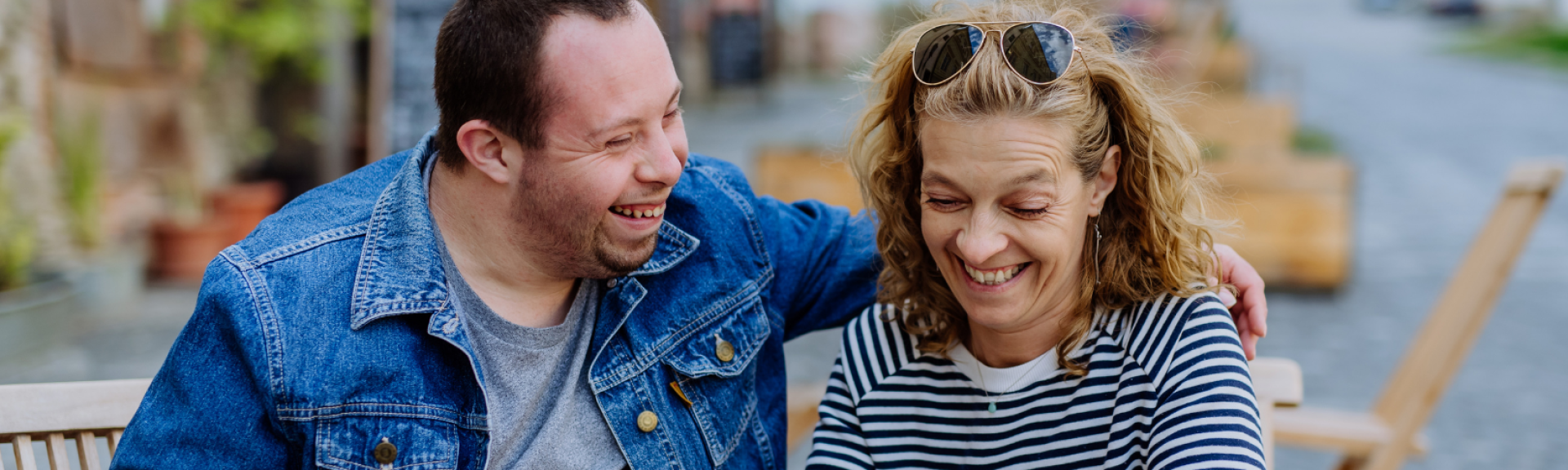 caregiver and client getting coffee, smiling