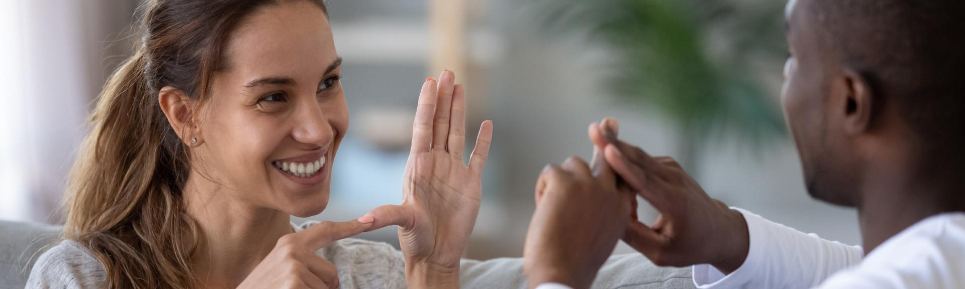 Woman and man using sign language