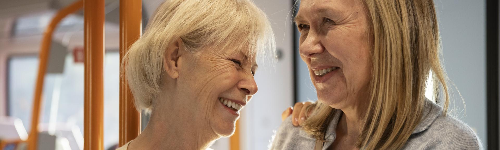 Older women smiling on a bus