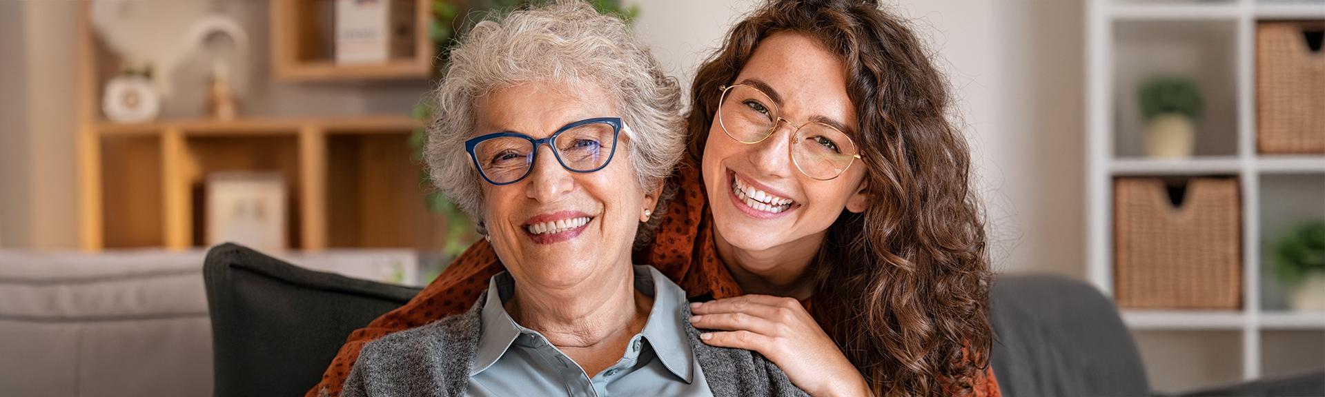 Elder woman and female companion on couch