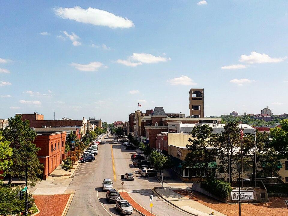 sunny downtown street with brick buildings