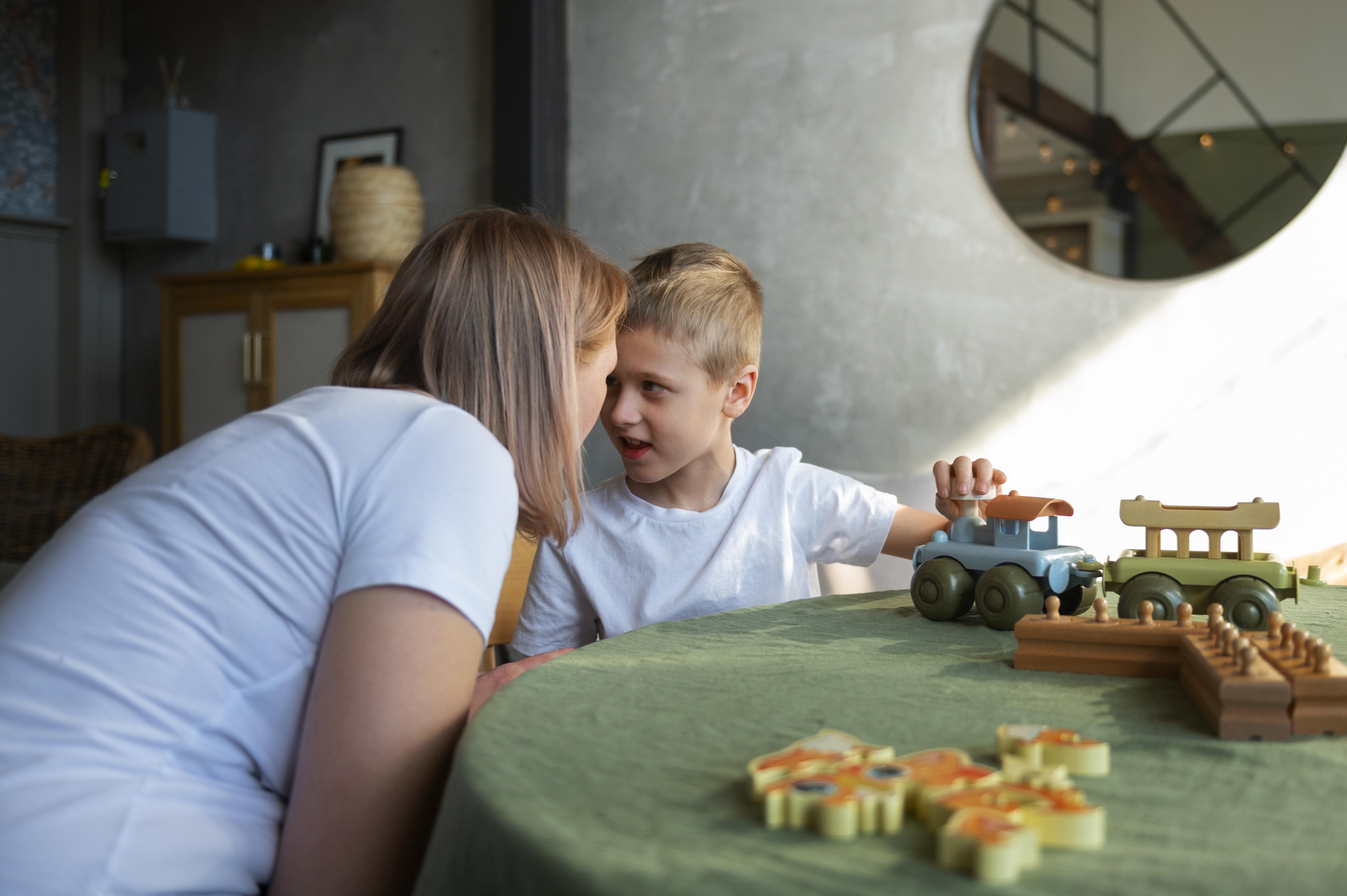 mother and son playing with wooden toys