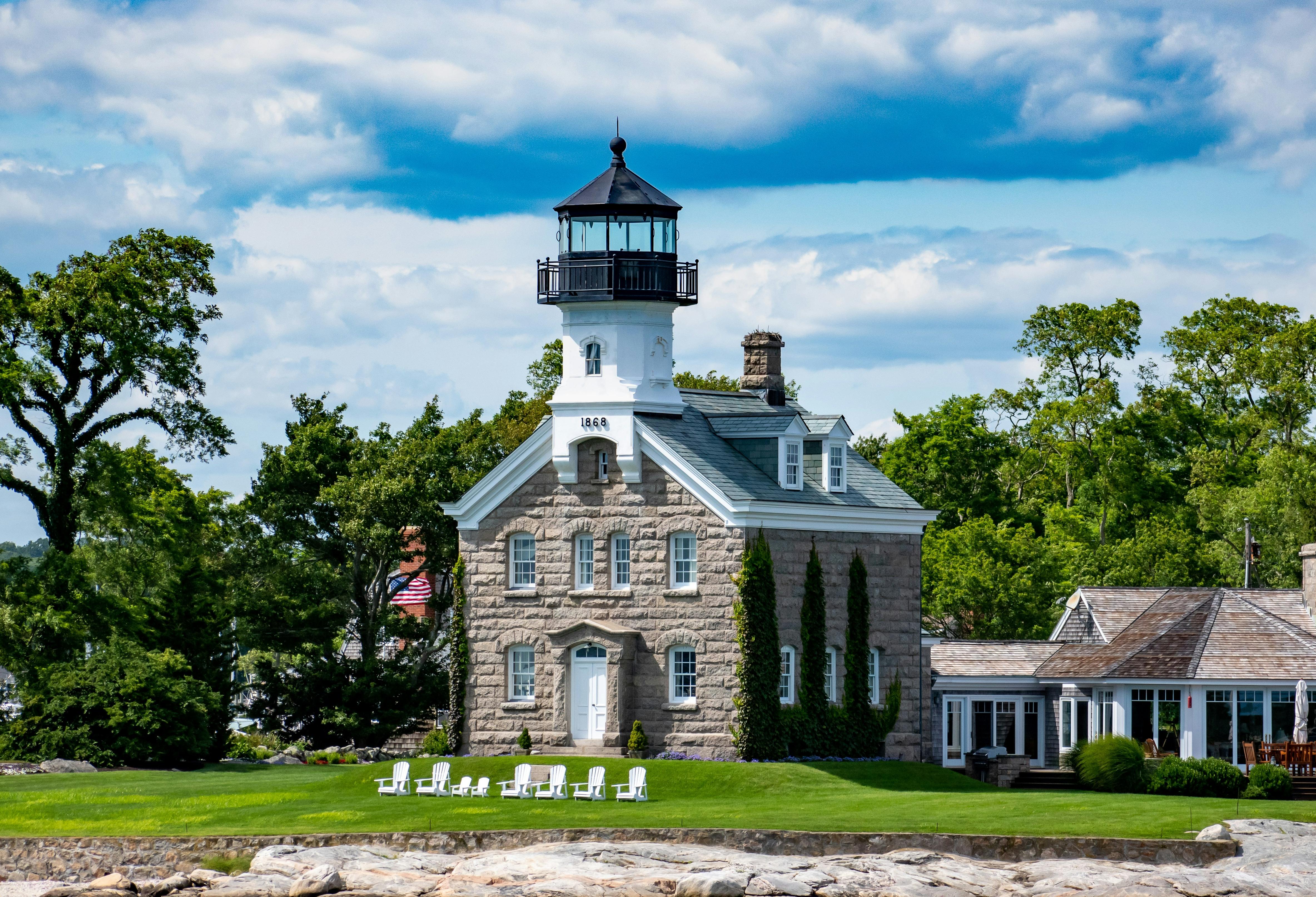 grey brick lighthouse in the summer